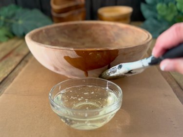 brush bleach onto sanded bowl