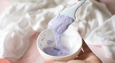 Small mixing bowl with purple macaron batter.