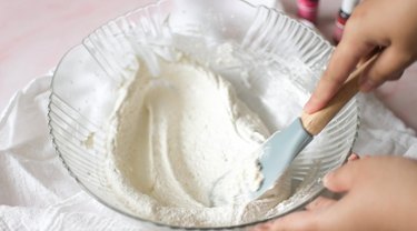 Glass bowl with macaron batter.