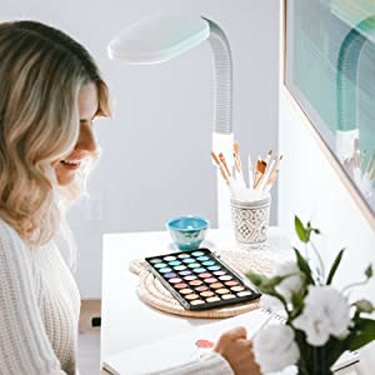 Woman Using Verilux Floor Lamp to Illuminate Craft Desk