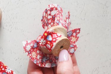 Apply decoupage to coat cabinet knob with fabric