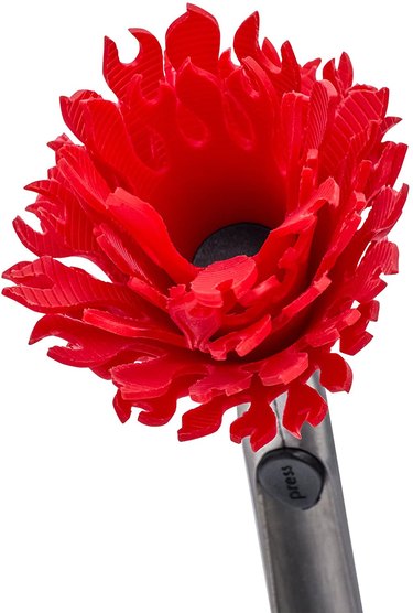 Flower-like head of a silicone barbecue brush, on a white ground