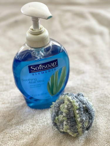 massage soap into the wool ball
