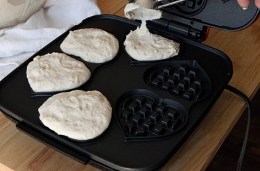 Adding sourdough discard waffle batter to waffle maker
