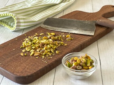 chopped pistachios on a cutting board
