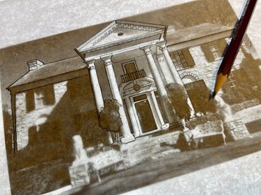 Pencil tracing photo of Graceland on light board