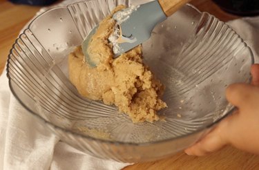 Mixing in dry ingredients.