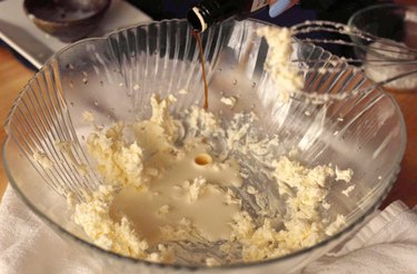 Adding vanilla to bowl.