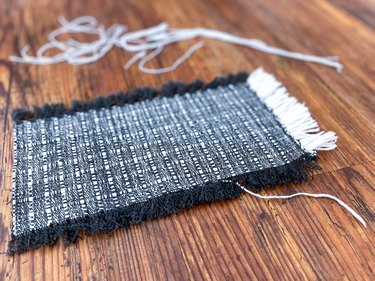 pull threads to create dollhouse rug fringe
