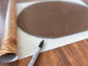 trace masonite shape onto contact paper