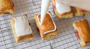 Piping rectangular borders on top of baked tarts