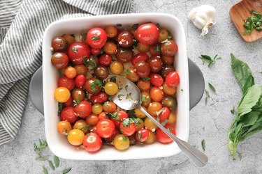 Toss tomatoes, olive oil, spices and herbs