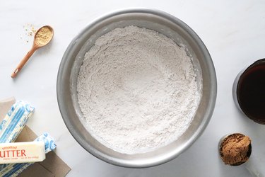 Mix dry ingredients for gingerbread cookie dough in a bowl