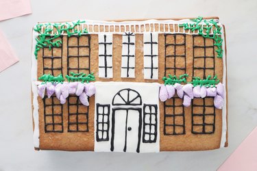 Gingerbread cookie mansion with icing vines and wisteria