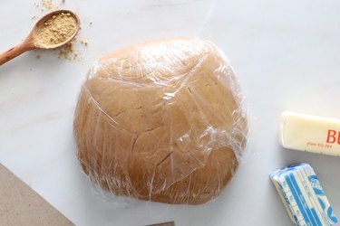 Gingerbread cookie dough wrapped in plastic