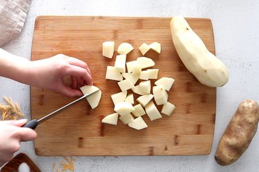 Potato chunks on cutting board