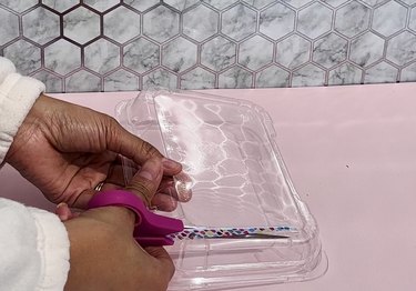 Cutting piece out of plastic lid
