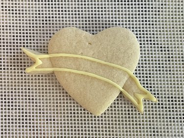 Heart-shaped sugar cookie with yellow banner outline