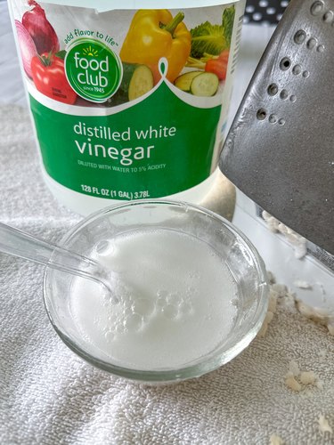 Add white vinegar to baking soda paste