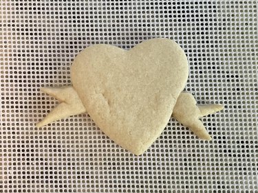 Plain heart cookie, freshly baked on white background