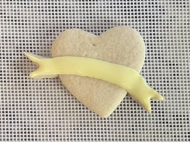 Heart-shaped sugar cookie with yellow banner