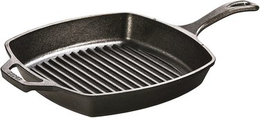 A square-shaped Lodge Cast Iron Grill Pan with ridges at the bottom and a curved handle.