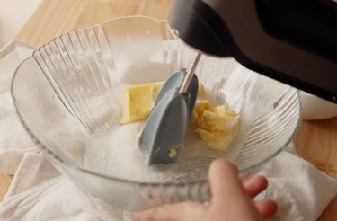 Whipping butter and sugar in a mixing bowl