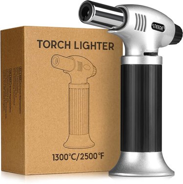 Gibot mini kitchen torch and box, on a white ground