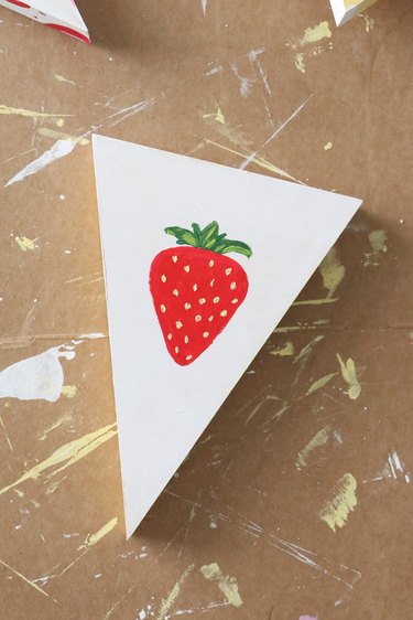 Paint strawberry on top cake layer