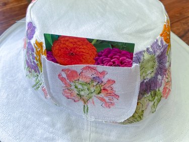 use the hat pocket to carry a packet of seeds