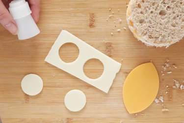 Cutting two small cheese circles