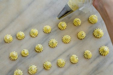 piping butter rosettes.
