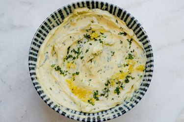 mixing butter, herb, lemon zest, salt, and garlic in a bowl.