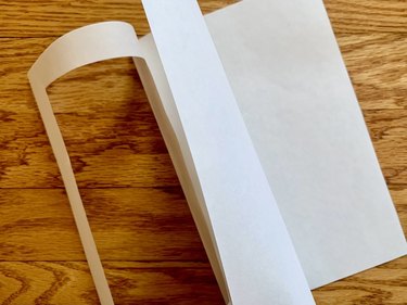 Open folded greeting card with plain white card stock page in center
