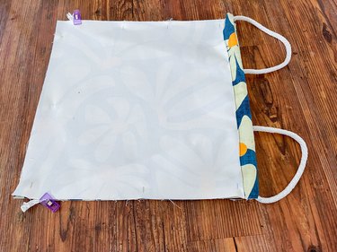 put rope ends into bag and clip ends 2 inches from the bottom edge