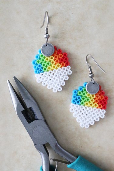 Perler bead rainbow snow cone with earring pieces on the back