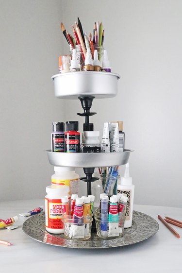 DIY tiered tray holding art supplies