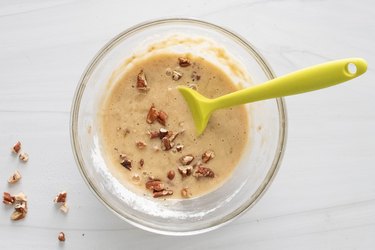 Adding nuts to banana bread batter
