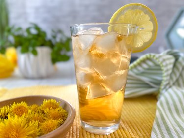 tall glass of dandelion iced tea with lemon