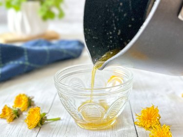 pour dandelion honey into jars