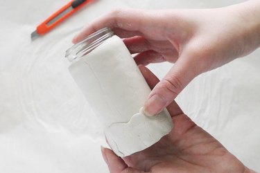 Smoothing out clay with water