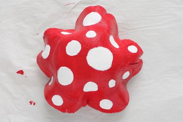 Painting white spots on red mushroom cap