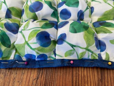fold bottom over twice and pin around placemat