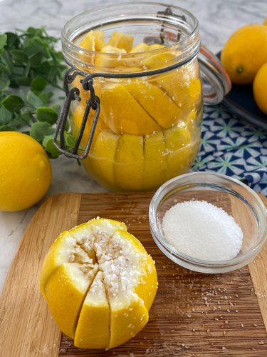 place salted lemons into jar