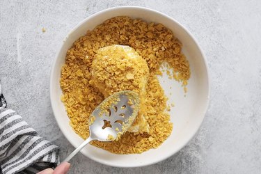 Coat ice cream drumsticks with crushed cornflakes