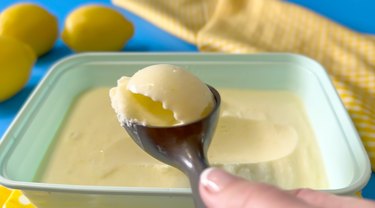 scooping lemon ice cream with an ice cream scoop