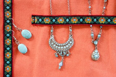 closeup of necklaces and earrings inside organizer
