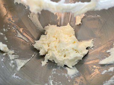 Creamed butter and sugar in silver bowl