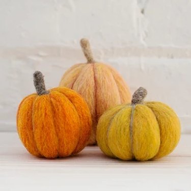 Three felted pumpkins