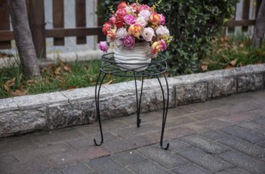 Mainstays Black Metal Plant Stand with a flower pot